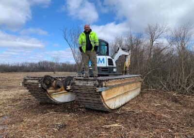 ILM Environments During invasive species removal with mulched material in foreground (phot courtesy of FHNWF)