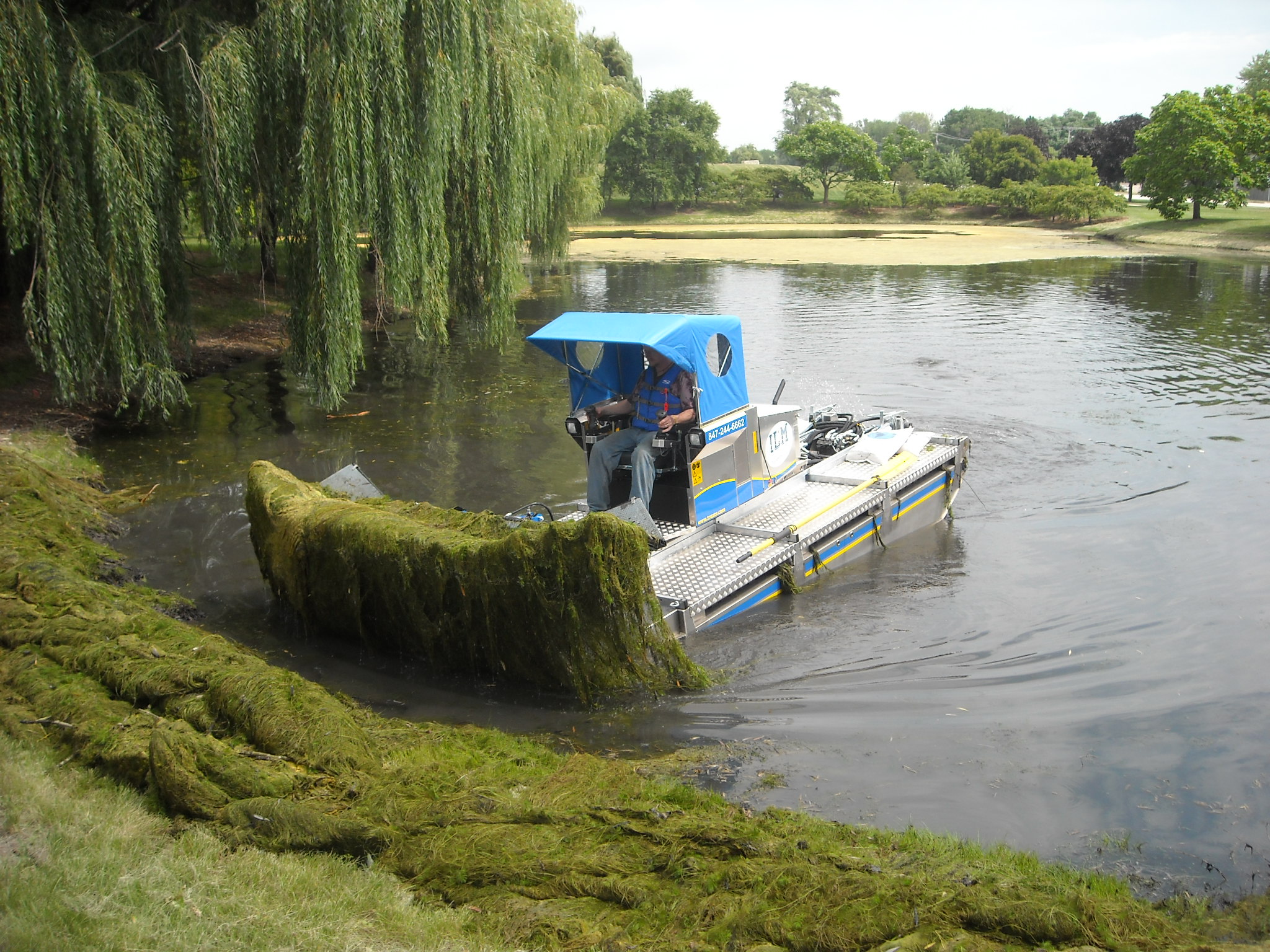 ILM Environments Specialty Equipment: The Truxor Offers Manual Removal of Algae & Aquatic Plant, Surface Skimming, Cutting, Harvesting, and Mowing.